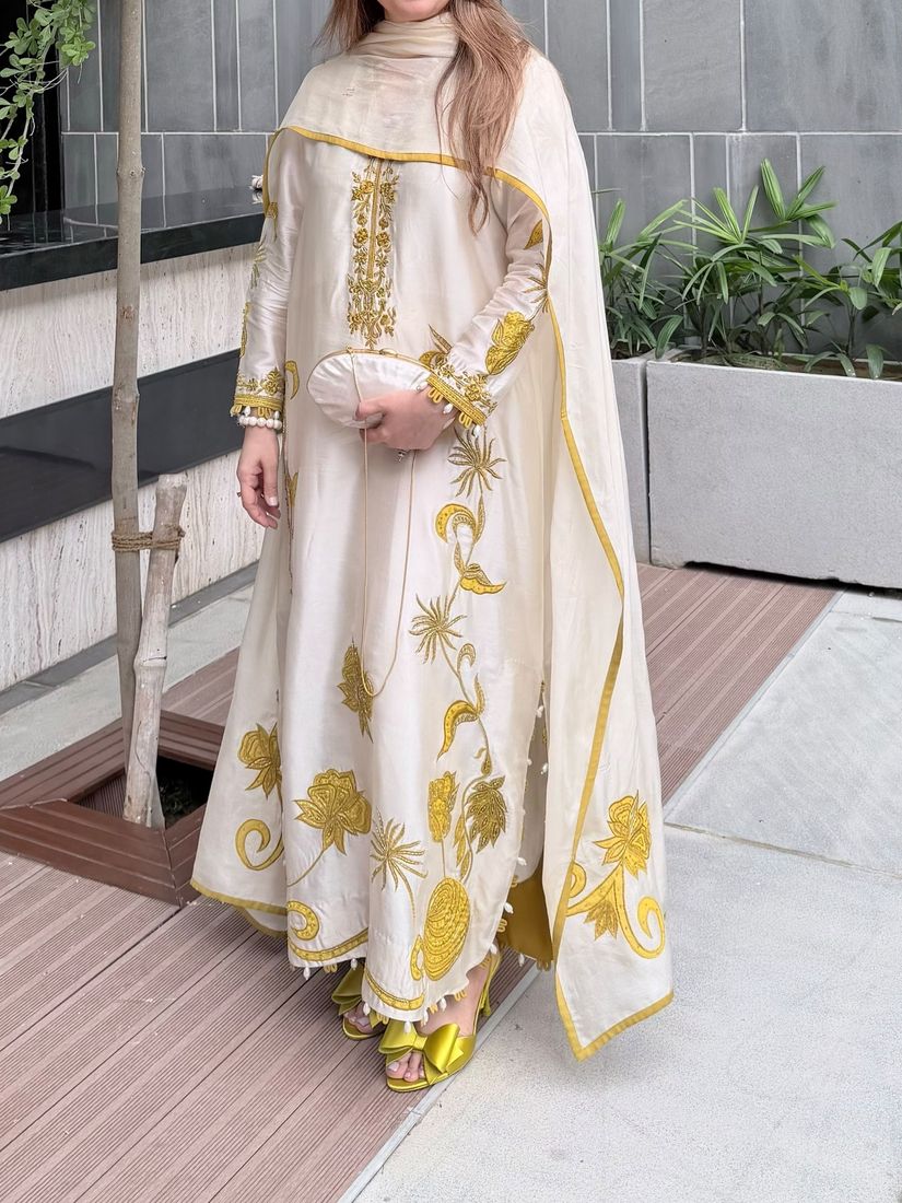 Ivory outfit with gold appliqué and a gold-edged dupatta