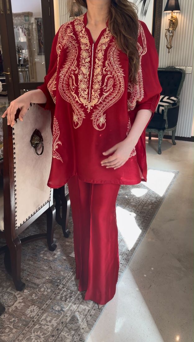 Red kaftan with gold embroidery and wide-leg trousers